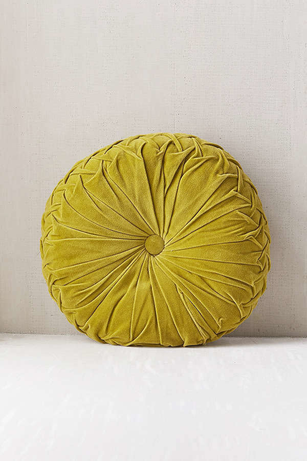 Get it <a href="https://www.urbanoutfitters.com/shop/round-pintuck-pillow?category=decorative-pillows-throw-blankets&amp;color=035" target="_blank">here</a>.&nbsp;