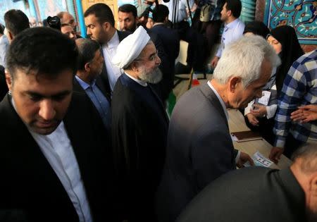 Iranian President Hassan Rouhani arrives to cast his vote during the presidential election in Tehran, Iran, May 19, 2017. TIMA via REUTERS