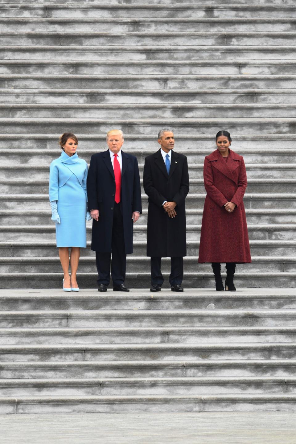 President Donald Trump stands with Melania Trump, former President Barack Obama and Michelle Obama, before the Obama's departs on Marine One after the 2017 Presidential Inauguration at the U.S. Capitol on Jan 20, 2017.