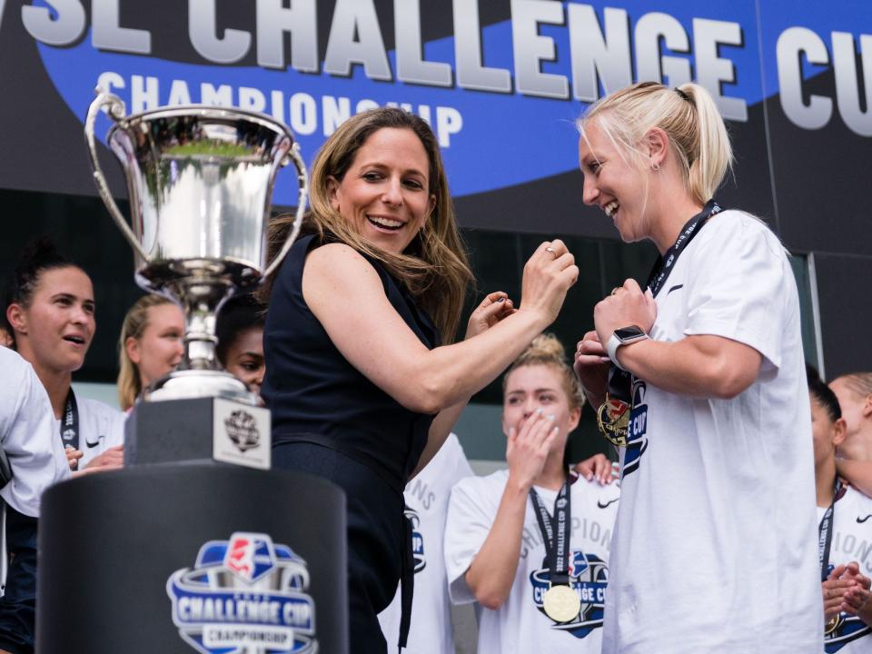 NWSL Commissioner Jessica Berman places medals around the necks of NC Courage players.