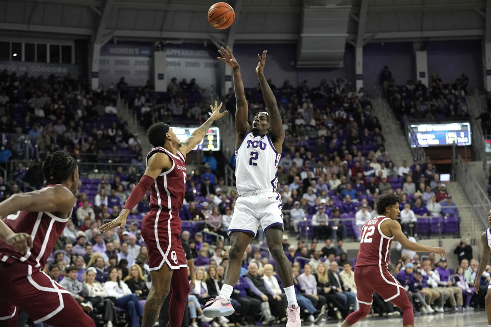 TCU forward Emanuel Miller (2) shoots against Oklahoma guard Rivaldo Soares (5) during the second half of an NCAA college basketball game in Fort Worth, Texas, Wednesday, Jan. 10, 2024. (AP Photo/LM Otero)