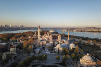 FILE-In this Saturday, April 25, 2020 file photo, an aerial view of the Byzantine-era Hagia Sophia, one of Istanbul's main tourist attractions in the historic Sultanahmet district of Istanbul.Turkey's Council of State on Friday, July 10, 2020, threw its weight behind a petition brought by a religious group and annulled a 1934 cabinet decision that changed the 6th century building into a museum. The ruling allows the government to restore the Hagia Sophia's previous status as a mosque.The decision was in line with the Turkish President's Recep Tayyip Erdogan's calls to turn the hugely symbolic world heritage site into a mosque despite widespread international criticism, including from the United States and Orthodox Christian leaders. (AP Photo)