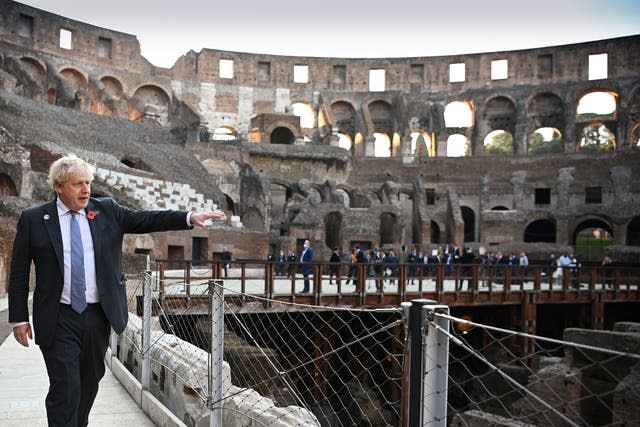 Prime Minister Boris Johnson visits the Colosseum during the G20 summit in Rome, Italy