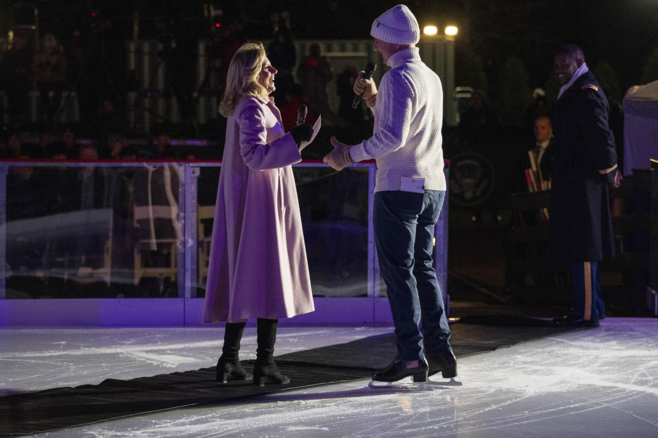 1988 Olympic figure skater Brian Boitano, right, skates next to first lady Jill Biden during the unveiling of the White House Holiday Ice Rink, located at the south panel of the South Lawn of the White House, Wednesday, Nov. 29, 2023, in Washington. (AP Photo/Jacquelyn Martin)