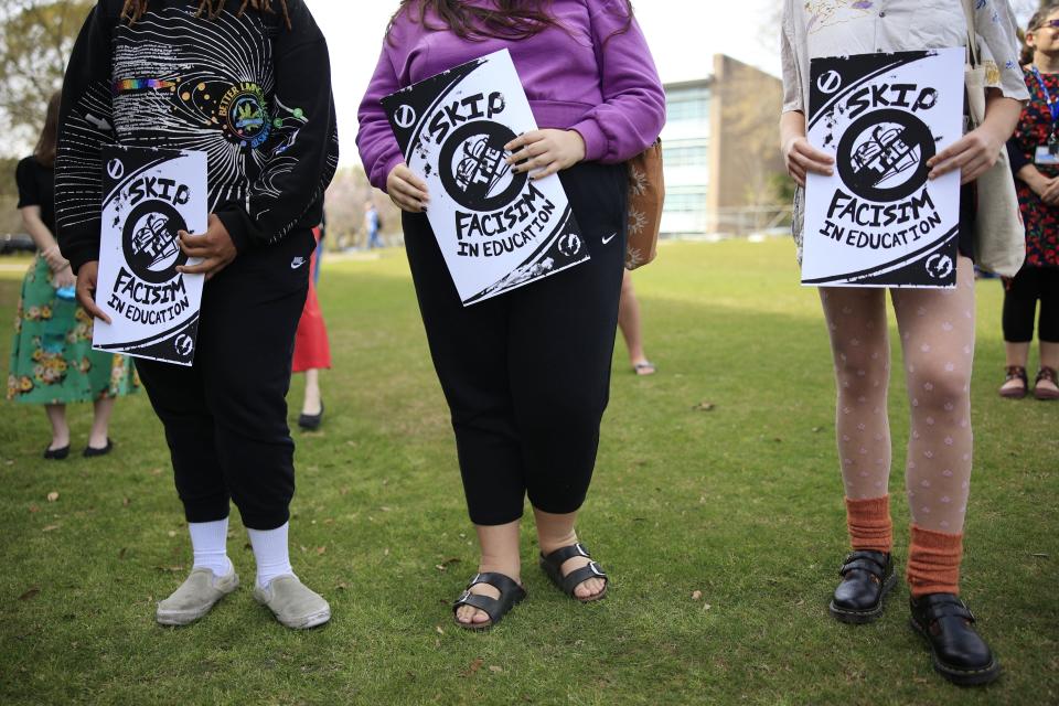 Dozens of people attended a Feb. 21 rally at the University of North Florida, some of whom protested "fascism in education."