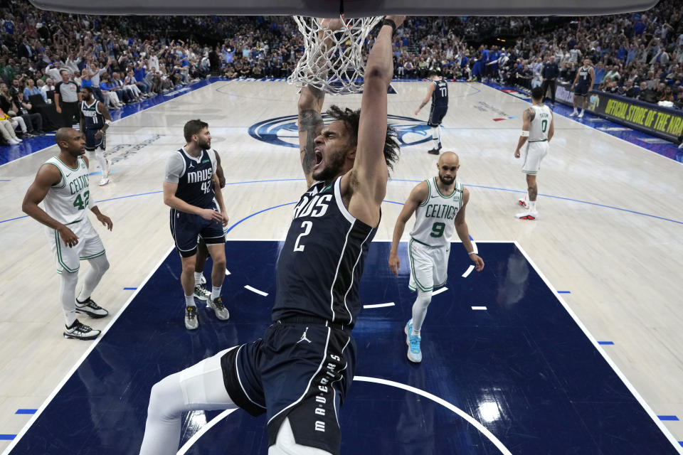 Dereck Lively II finishes a dunk in the Mavs' blowout win. (Stacy Revere/Getty Images)