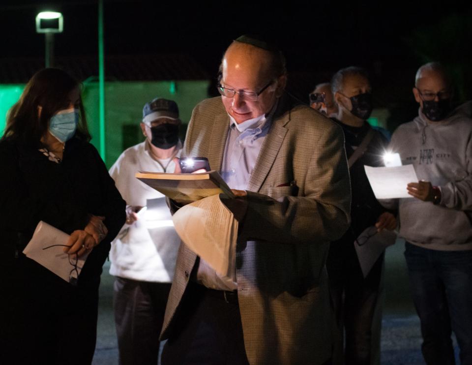 Rabbi Steven Rosenberg, center, leads 25 members of Temple Isaiah in Palm Springs, Calif., in the blessings of Hanukkah on November 28, 2021.