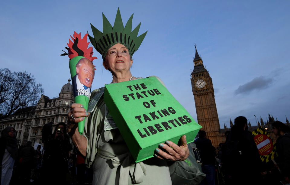 <p>A demonstrator dressed as the Statue of Liberty takes part in a protest against U.S. President Donald Trump in London, Feb. 20, 2017. (Photo: Toby Melville/Reuters) </p>