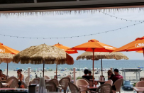 <p><a href="https://www.thedailymeal.com/bars/bernies-beach-bar?venue_update=1&referrer=yahoo&category=beauty_food&include_utm=1&utm_medium=referral&utm_source=yahoo&utm_campaign=feed" rel="nofollow noopener" target="_blank" data-ylk="slk:Bernie’s;elm:context_link;itc:0;sec:content-canvas" class="link ">Bernie’s</a> provides a stage for some of the best local live bands, with concerts nearly every night during the summer. Party on the deck all afternoon long, or pop inside if you need a little AC. Either way, you’ll be surrounded by stunning views of the Atlantic Ocean. Try Bernie’s conch fritters and award-winning <a href="https://www.thedailymeal.com/free-tagging-cuisine/clam-chowder?referrer=yahoo&category=beauty_food&include_utm=1&utm_medium=referral&utm_source=yahoo&utm_campaign=feed" rel="nofollow noopener" target="_blank" data-ylk="slk:clam chowder;elm:context_link;itc:0;sec:content-canvas" class="link ">clam chowder</a>, and wash it all down with a $12 bucket of Landshark or Shock Top beer.</p>