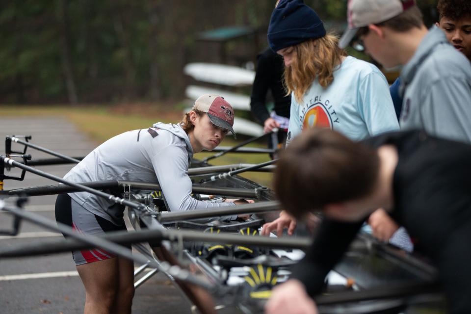 Capital City rowers check their boats before taking them out for practice on Lake Hall Saturday, Jan. 6, 2024.