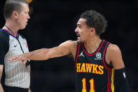 Atlanta Hawks guard Trae Young (11) talks with an official during the second half of an NBA basketball game against the New York Knicks Saturday, Nov. 27, 2021, in Atlanta. (AP Photo/Hakim Wright Sr.)