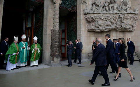 Spain's King Felipe, center and Queen Letizia, center right arrive to attend a solemn Mass at Barcelona's Sagrada Familia Basilica for the victims of the terror attacks that killed 14 people and wounded over 120 in Barcelona - Credit: AP