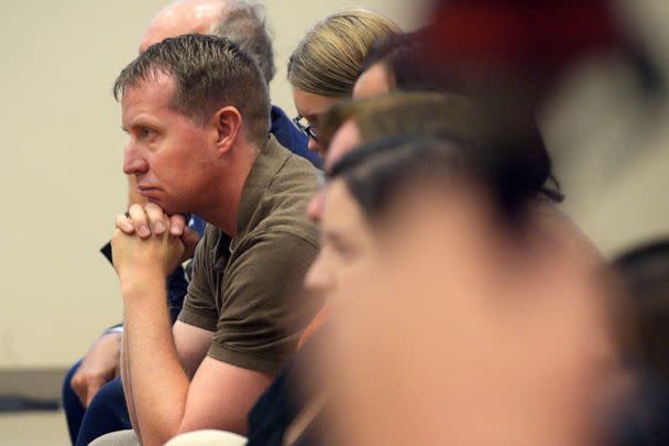 PHOTO: Robbie Parker, parent of Emilie Parker, listens to Attorney Chris Mattei during closing statements in the Alex Jones Sandy Hook defamation damages trial in Superior Court in Waterbury, Conn., on Oct. 6, 2022. (H. John Voorhees III/Hearst Connecticut Media, Pool via AP)