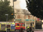 Firefighters arrive to battle a fire at a department store in Chingford, London, Britain August 23, 2017 in this still image obtained from social media. Jonathan Boyce/@JonathanBoyce24 via REUTERS THIS IMAGE HAS BEEN SUPPLIED BY A THIRD PARTY. NO RESALES. NO ARCHIVES. MANDATORY CREDIT