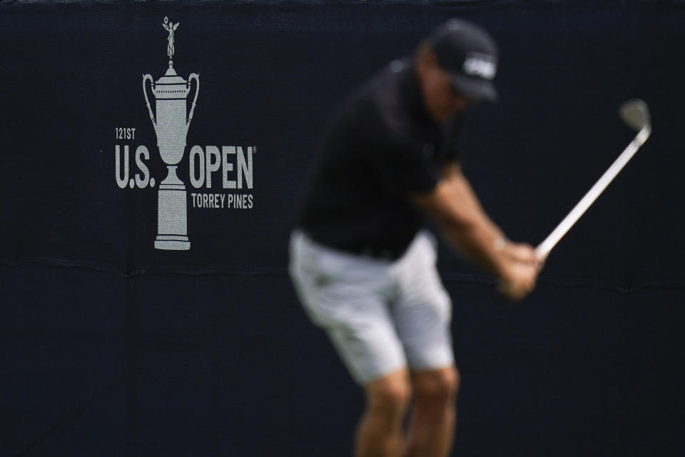 Phil Mickelson chips a shot on the 13th hole during a practice round of the U.S. Open Golf Championship Monday, June 14, 2021, at Torrey Pines Golf Course in San Diego. (AP Photo/Gregory Bull)