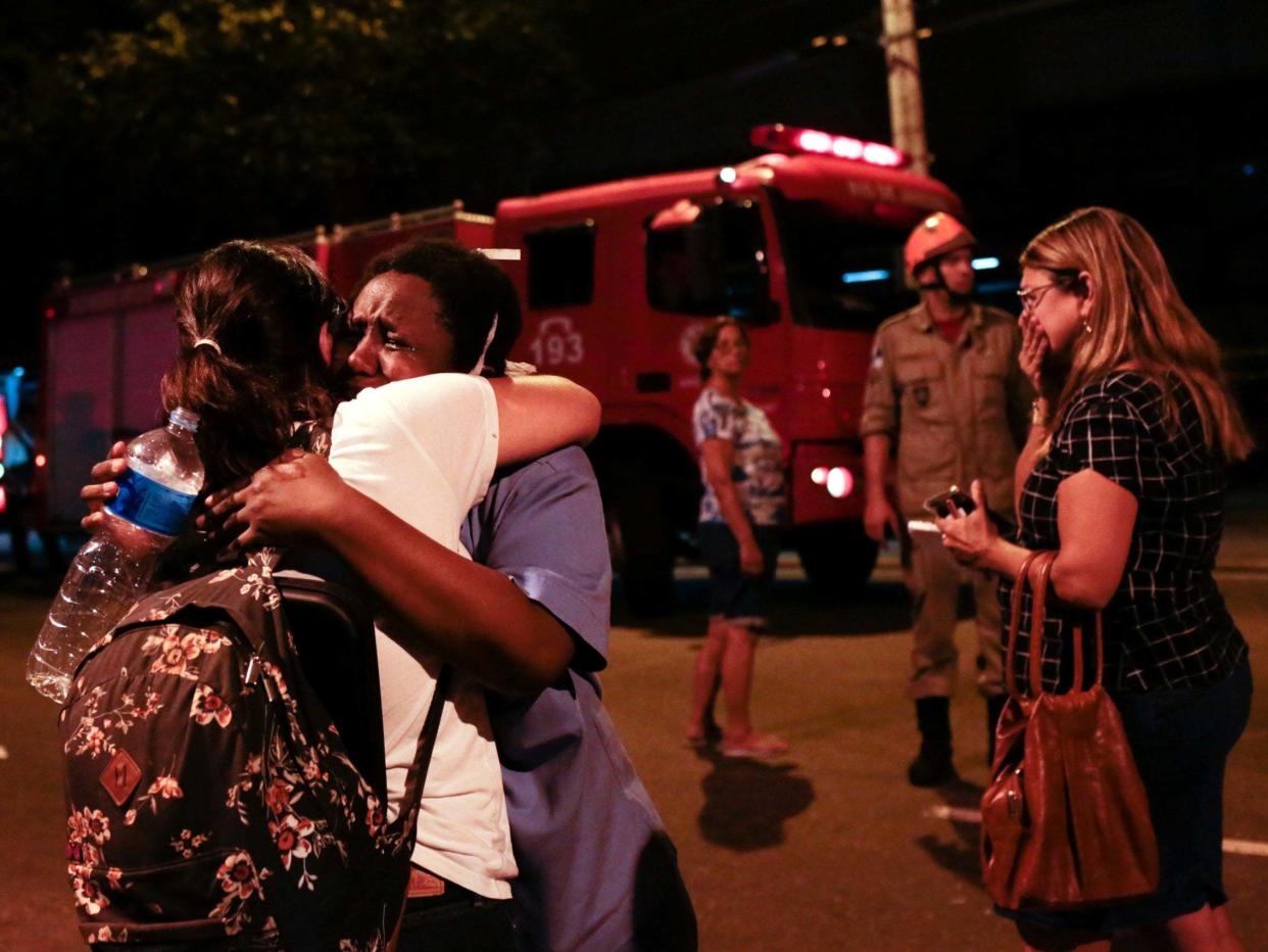 There were scenes of chaos and grief outside the Badim Hospital, Rio de Janeiro, as fire raged through wards: Reuters