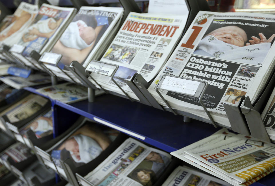 British newspapers are displayed for sale in London, Wednesday, July 24, 2013. The newspapers show coverage of the new royal baby boy, third in line to the throne. (AP Photo/Kirsty Wigglesworth)