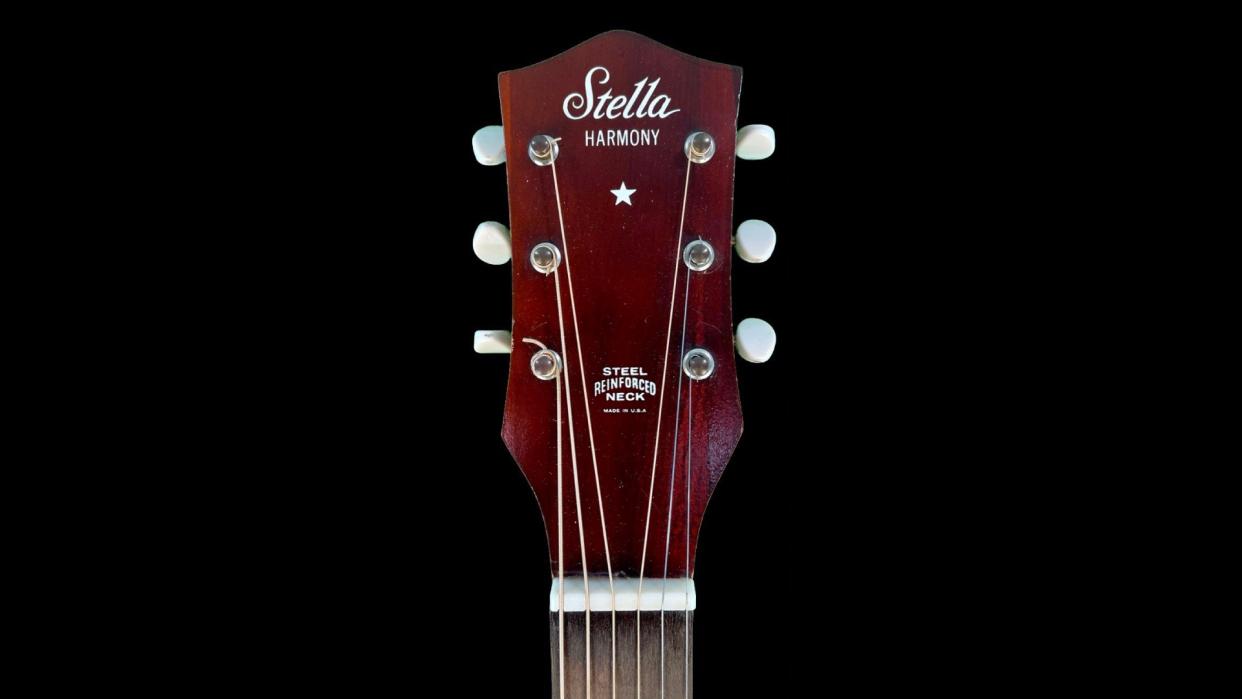  A guitar headstock boasting the Stella and Harmony logos 