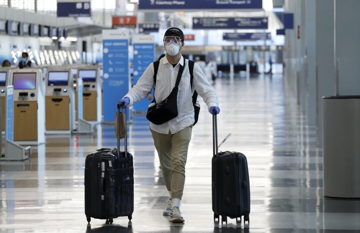 <span class="caption">Chicago's O'Hare and other U.S. airports remain largely empty despite increased mask wearing and other measures to prevent COVID-19 spread. </span> <span class="attribution"><span class="source">AP Photo/Nam Y. Huh</span></span>