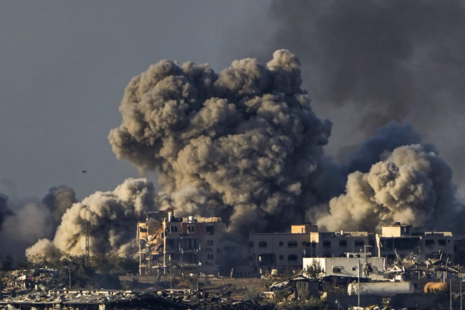 FILE - Smoke rises following an Israeli bombardment in the Gaza Strip, as seen from southern Israel, Saturday, Dec. 16, 2023. More Americans think foreign policy should be a top focus for the U.S. government in 2024 amid ongoing wars in the Gaza Strip and Ukraine, with a new poll showing overseas concerns and immigration rising in importance, even as they’re overshadowed by long-standing economic worries. (AP Photo/Ariel Schalit, File)