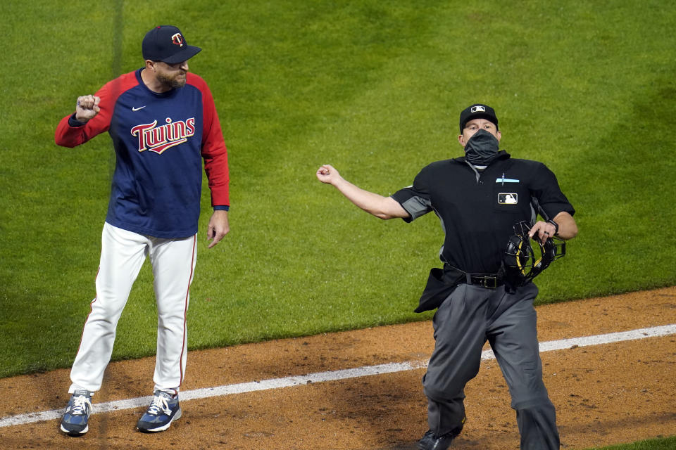 Minnesota Twins manager Rocco Baldelli, left, is ejected by home plate umpire Jim Reynolds after complaining about the ejection of pitcher Tyler Duffey in the seventh inning of the team's baseball game against the Chicago White Sox on Tuesday, May 18, 2021, in Minneapolis. (AP Photo/Jim Mone)