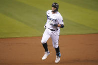 Miami Marlins' Miguel Rojas rounds the bases after hitting a solo home run during the first inning of a baseball game against the Arizona Diamondbacks, Thursday, May 6, 2021, in Miami. (AP Photo/Lynne Sladky)