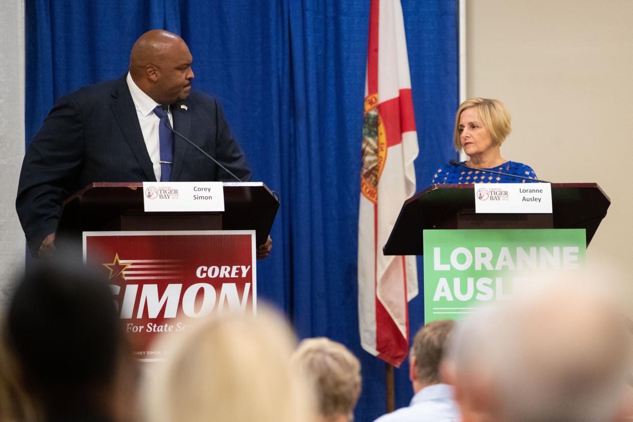 Senate District 3 candidate Corey Simon reacts to his opponent, Sen. Loranne Ausley’s response to a question during a debate hosted by the Capital Tiger Bay Club on Monday, Oct. 3, 2022.