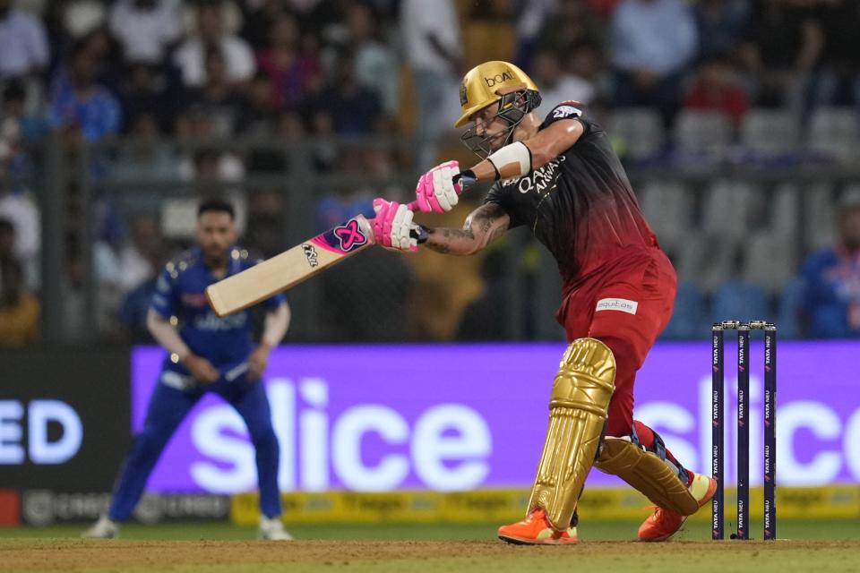 Royal Challengers Bangalore's Faf du Plessis plays a shot during the Indian Premier League cricket match between Mumbai Indians and Royal Challengers Bangalore in Mumbai, India, Tuesday, May 9, 2023. (AP Photo/Rajanish Kakade)