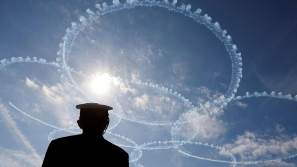 Japan Air Self-Defense Force"s (JASDF) aerobatic flight team "Blue Impulse" performs during an International Fleet Review to commemorate the 70th anniversary of the foundation of Japan"s Maritime Self-Defense Force (JMSDF), at Sagami Bay, off Yokosuka, south of Tokyo,