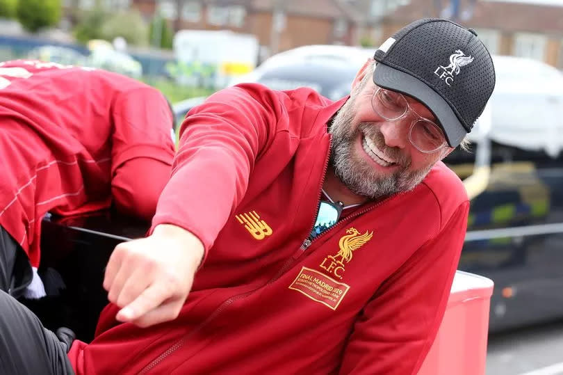 Liverpool's Jurgen Klopp on board a parade bus after winning the UEFA Champions League final against Tottenham Hotspur in Madrid on June 2, 2019