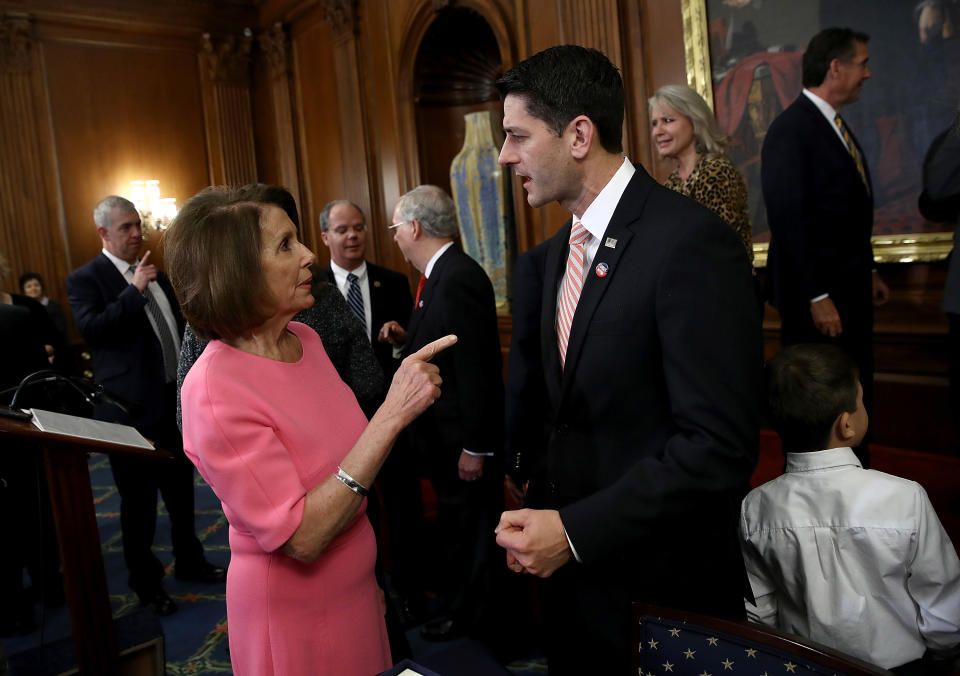 Speaker of the House Paul Ryan, R-Wis, speaks with House Minority Leader Nancy Pelosi, D-Calif., following an event marking the passage of the 21st Century Cures Act at the U.S. Capitol on Dec. 8, 2016, in Washington, D.C. (Photo: Win McNamee/Getty Images)