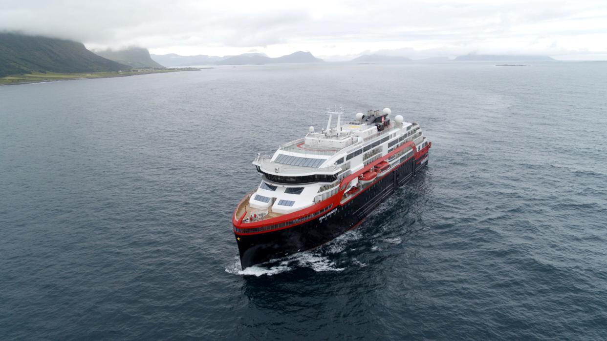 Hurtigruten's cruise ship MS Roald Amundsen is seen in the sea near Ulsteinvik, Norway July 1, 2019. Hurtigruten/Handout via Reuters