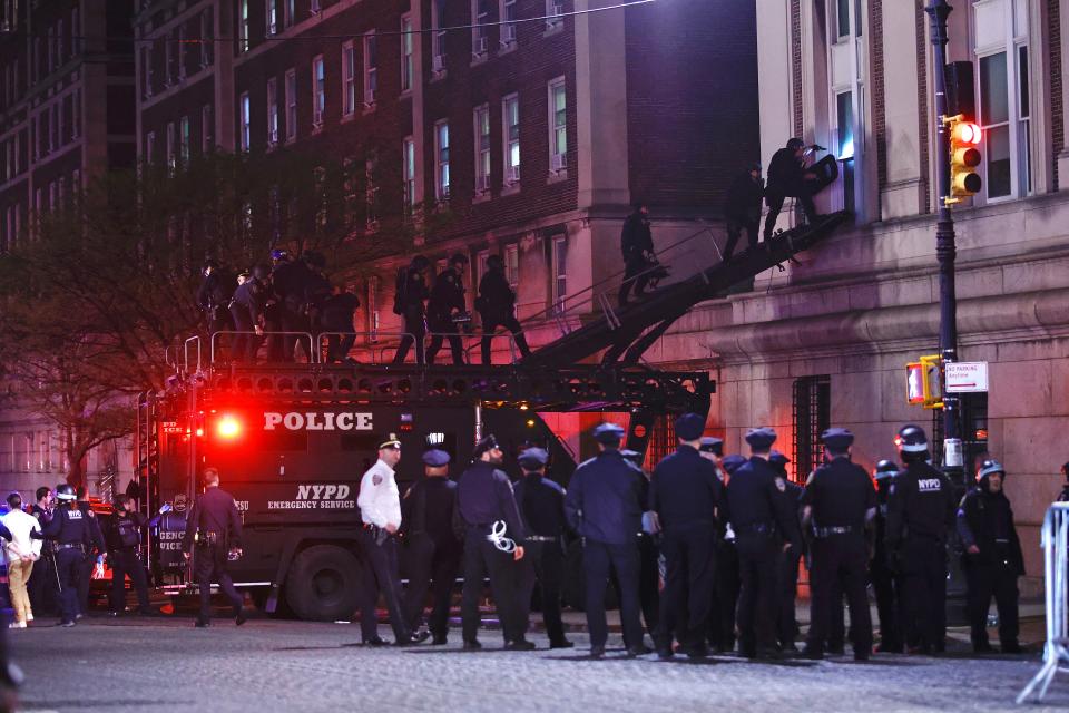 NYPD enters Columbia campus building via ladders on April 30, 2024.