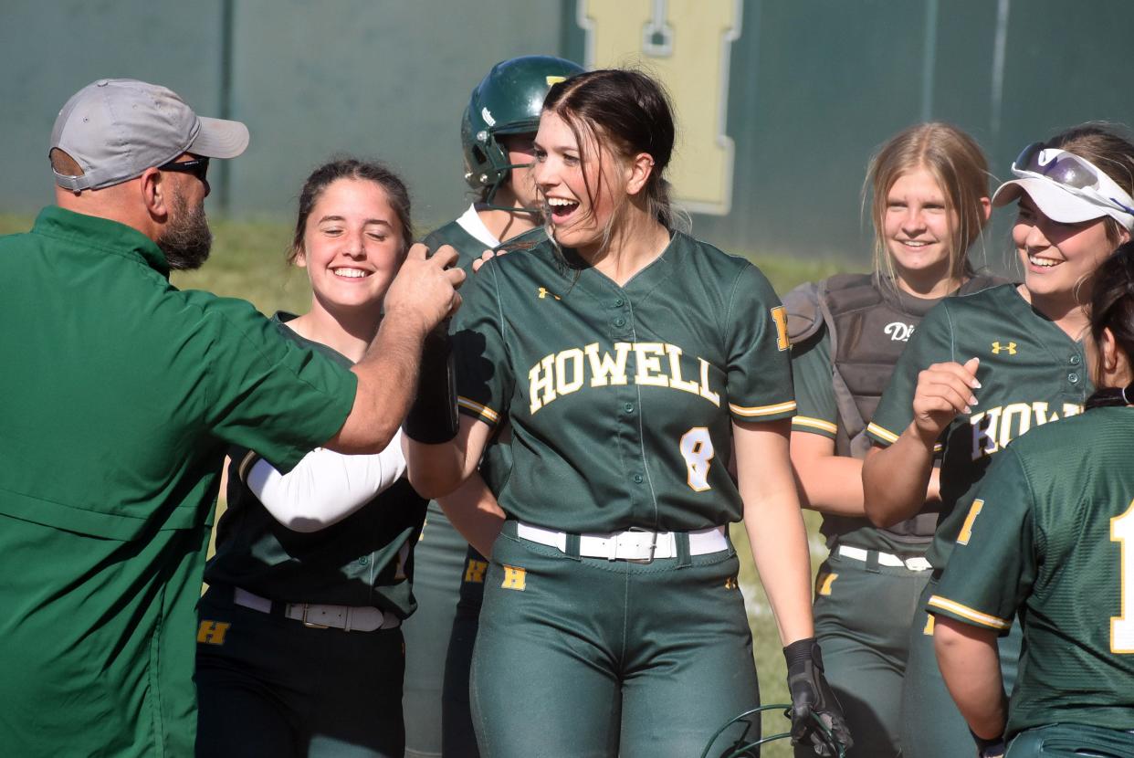 Howell's Jada Challiss (8) is congratulated after hitting what proved to be the game-winning three-run homer in a 9-7 victory over Lakeland on Thursday, May 25, 2023.