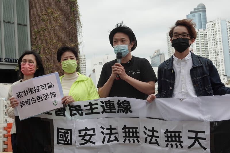 FILE PHOTO: Pro-democracy activists Helena Wong Pik-wan and Jimmy Sham arrive to report to the police station over the national security law charges, in Hong Kong