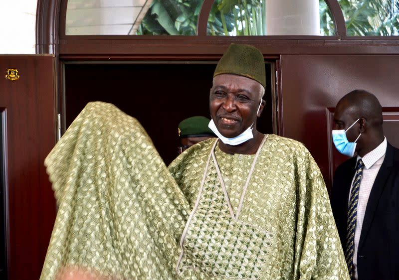 The new interim president of Mali, former colonel Ndaw, gestures after a meeting with Economic Community of West African States (ECOWAS) mediators, in Bamako