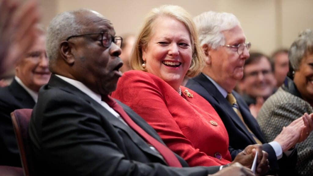 Associate Supreme Court Justice Clarence Thomas sits with his wife and conservative activist Virginia Thomas while he waits to speak at the Heritage Foundation on October 21, 2021 in Washington, DC. (Photo by Drew Angerer/Getty Images)