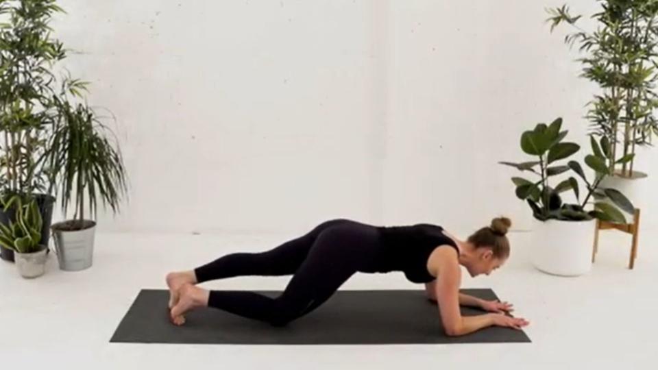 Evolve Pilates founder Veronique Ellis demonstrating  knee taps