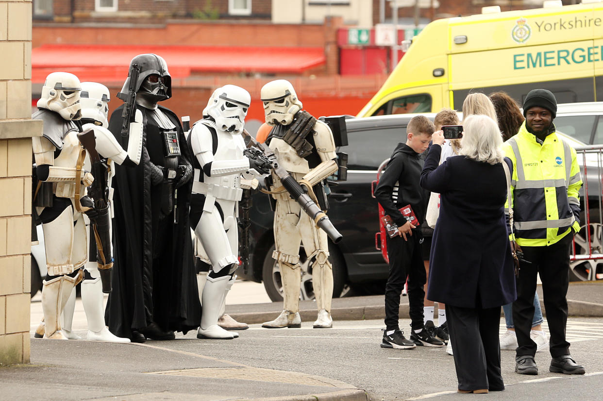 Darth Vader and stormtrooper impersonators pose for photos in Sheffield, England, on May 4.