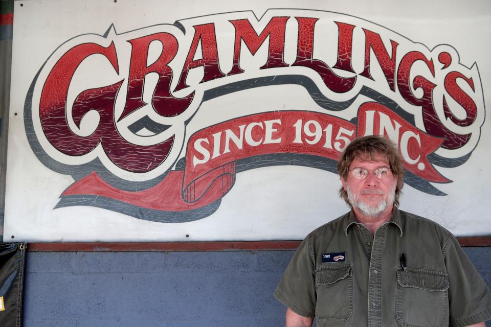 Stan Gramling, owner of Gramling's feed store, poses for a photo outside the store Thursday, May 23, 2019. Gramling's is set to close at the end of June after 104 years of being in business. 