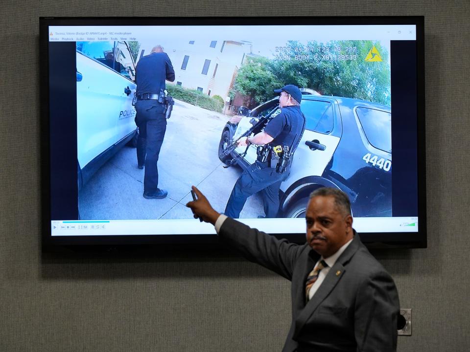 Prosecutor Dexter Gilford shows a video of the shooting in his opening statement Monday.