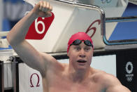 Tom Dean of Britain celebrates after winning the final of the men's 200-meter freestyle at the 2020 Summer Olympics, Tuesday, July 27, 2021, in Tokyo, Japan. (AP Photo/Matthias Schrader)