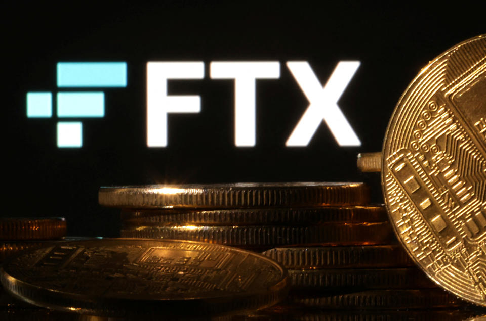 Representations of cryptocurrencies are seen in front of displayed FTX logo in this illustration taken November 10, 2022. REUTERS/Dado Ruvic/Illustration