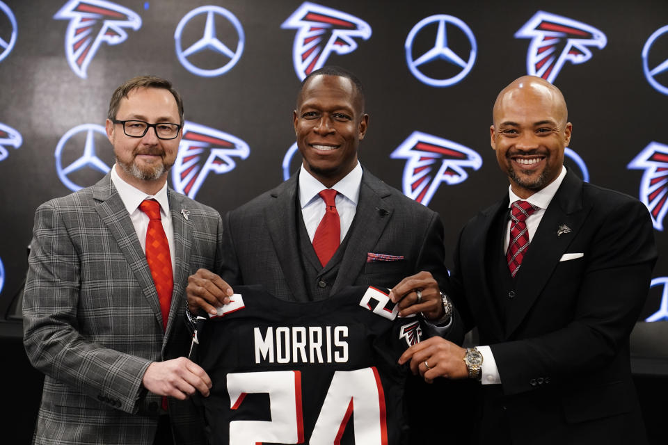 Atlanta Falcons president, Greg Beadles, left, head coach Raheem Morris, center, and general manager Terry Fontenot, right, pose after an NFL football news conference, Monday, Feb. 5, 2024, in Atlanta. (AP Photo/Brynn Anderson)