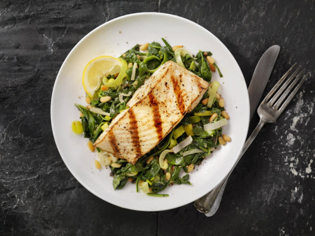 <p><a href="https://www.gettyimages.com/detail/photo/grilled-halibut-with-spinach-leeks-and-pine-nuts-royalty-free-image/503337620?phrase=halibut&adppopup=true" rel="nofollow noopener" target="_blank" data-ylk="slk:LauriPatterson/Getty Images;elm:context_link;itc:0;sec:content-canvas" class="link ">LauriPatterson/Getty Images</a></p>