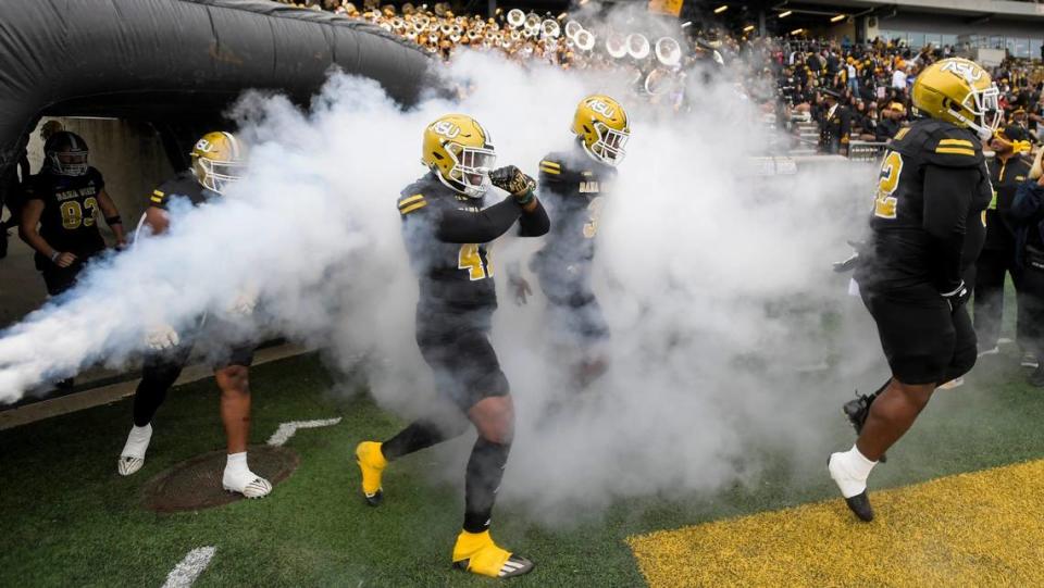 Alabama State players take the field against Tuskegee University for the Turkey Day Classic on the ASU campus in Montgomery, Ala., on Thursday November 23, 2023.