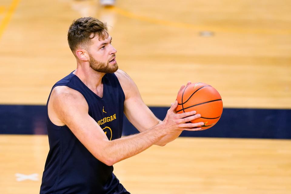 Michigan center Hunter Dickinson shoots a free throw during practice Friday, Oct. 14, 2022, in Ann Arbor.