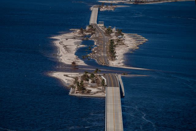 <p>Ricardo Arduengo/Getty Images</p> An aerial picture taken on September 30, 2022 shows the collapsed Sanibel Causeway.