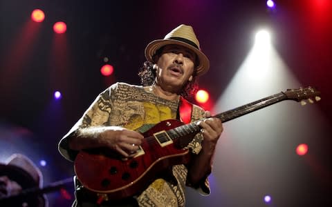 Carlos Santana, whose band played at Woodstock in 1969 and were booked to play again this year - Credit: Philip Hollis for DT Arts and Books