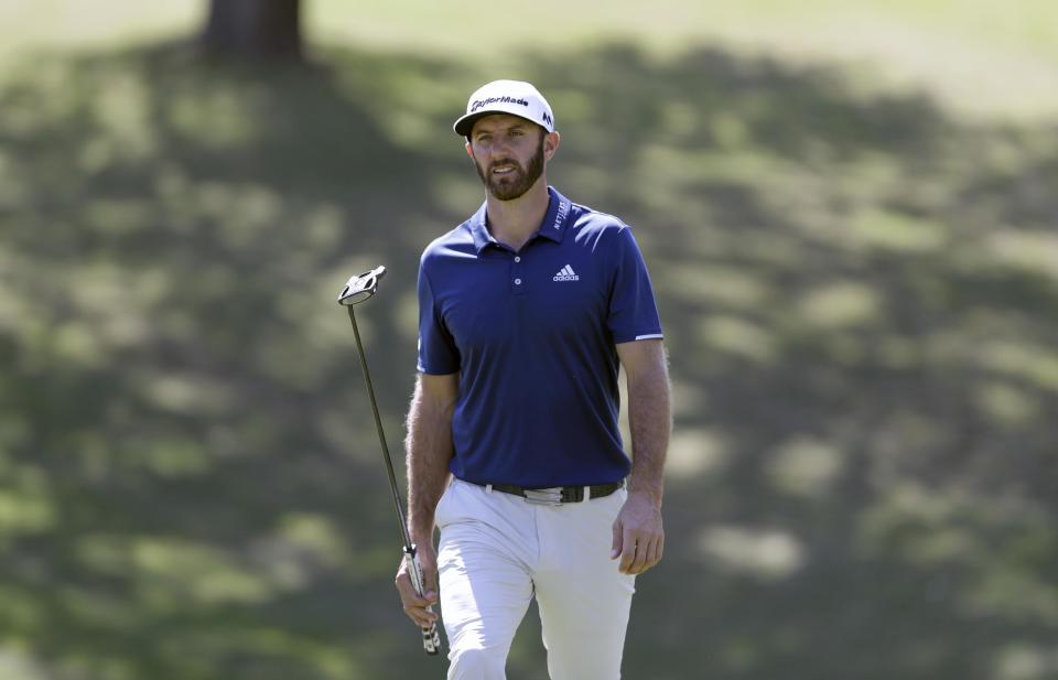 Dustin Johnson walks to the 18th green during a practice round for the Dell Match Play Championship golf tournament at Austin County Club, Tuesday, March 21, 2017, in Austin, Texas. (AP Photo/Eric Gay)